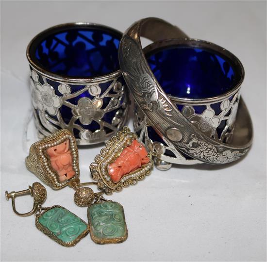 A Chinese coral and silver gilt ring similar earring, two turquoise mounted earrings, pair of salts and a bangle